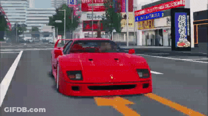 A Red Sports Car Is Driving Down A Street In Front Of A Building With A Sign That Says 1 3 4 5 6 7 8 9 GIF