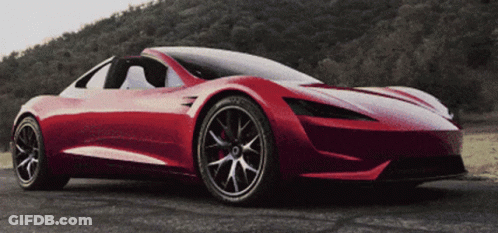 A Red Sports Car Is Parked On The Road GIF