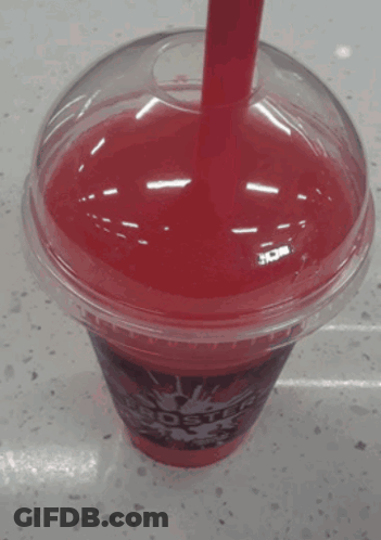 A Red Star Cup With A Red Straw In It GIF