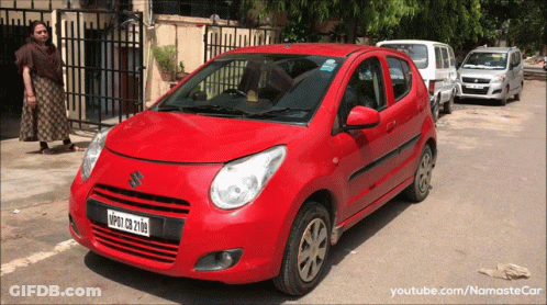 A Red Suzuki Car With A License Plate That Says Nmp27 Cb 2108 GIF