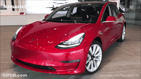 A Red Tesla Model 3 Is Displayed On A Youtube Video GIF