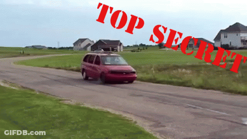 A Red Van Is Driving Down A Road With Top Secret Written On The Bottom GIF