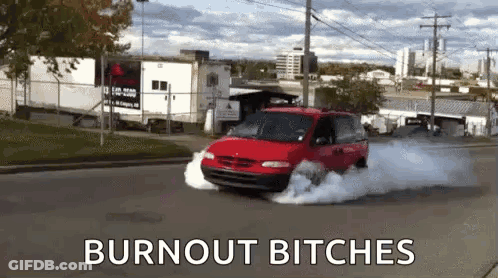 A Red Van Is Driving Down A Street With Smoke Coming Out Of It And The Words Burnout Bitches On The Bottom . GIF