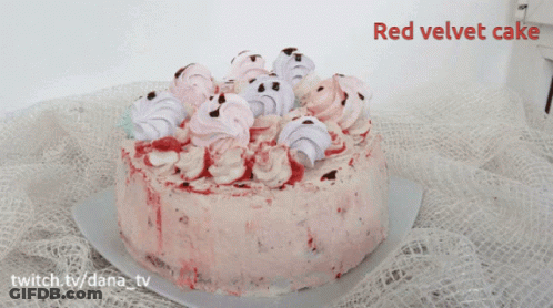 A Red Velvet Cake Is Sitting On A Table GIF