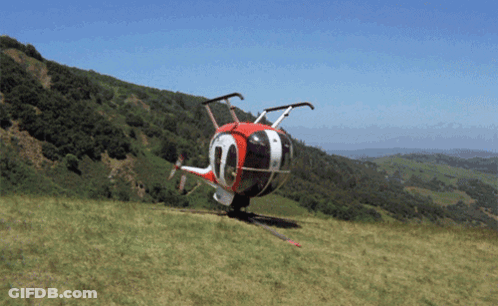 A Red White And Black Helicopter With The Number 10 On The Side GIF