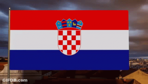A Red White And Blue Flag With A Checkered Crest GIF