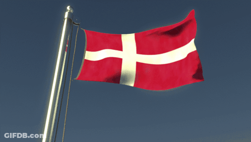 A Red White And Blue Flag With A Cross On It GIF