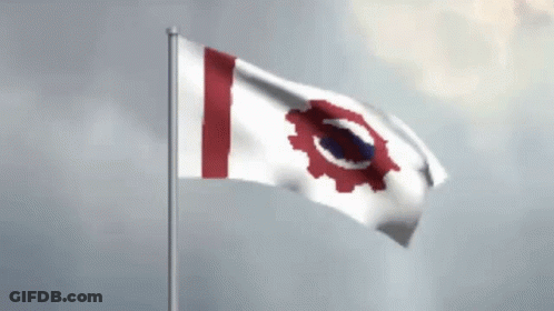 A Red White And Blue Flag With A Gear On It Is Waving In The Wind GIF