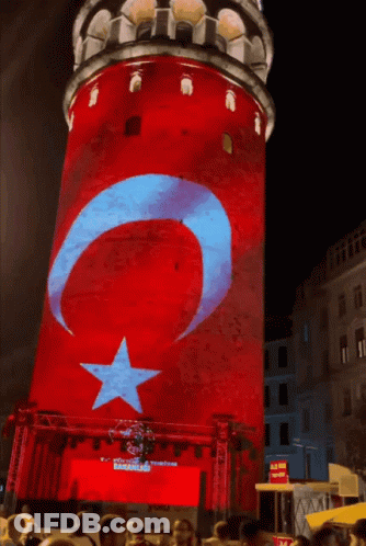 A Red White And Blue Tower With A Star And Crescent Moon On It GIF