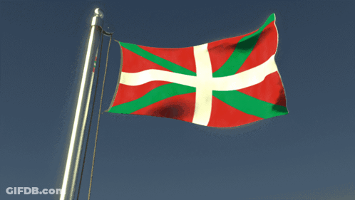 A Red White And Green Flag With A White Cross On It GIF