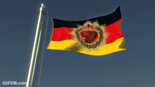 A Red Yellow And Black Flag With A Heart And Thorns On It GIF