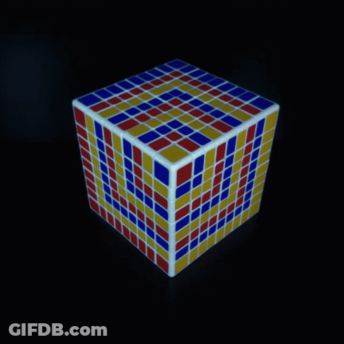 A Red Yellow And Blue Rubik 'S Cube On A Dark Background GIF