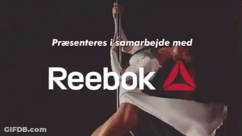 A Reebok Ad With A Man Doing A Handstand GIF