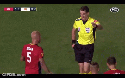 A Referee Gives A Yellow Card To A Player With The Number 5 GIF