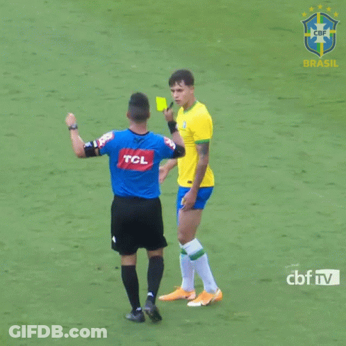 A Referee Giving A Yellow Card To A Soccer Player With A Tcl Logo On His Shirt GIF
