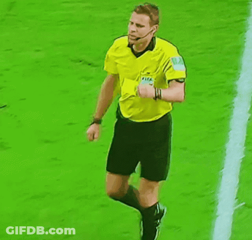 A Referee Holds Up A Red Card And A Yellow Card During A Soccer Game GIF