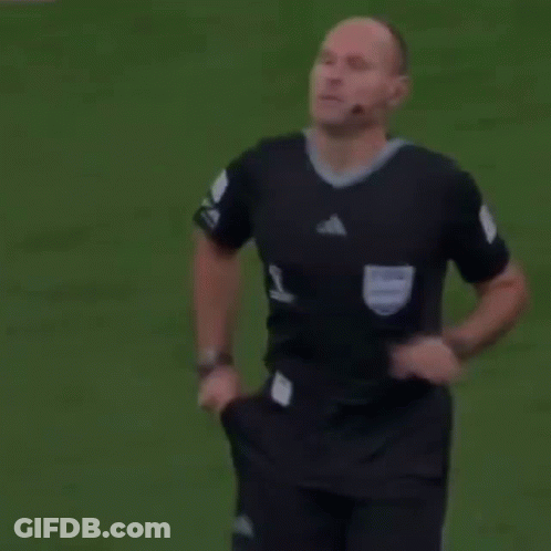 A Referee Holds Up A Yellow Card That Says Fifa GIF