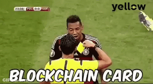 A Referee Is Giving A Yellow Card To A Soccer Player On The Field . GIF