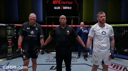 A Referee Stands Between Two Fighters In A Ufc Fight GIF
