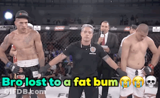 A Referee Stands Between Two Fighters With The Words Bro Lost To A Fat Bum Written Above Them GIF