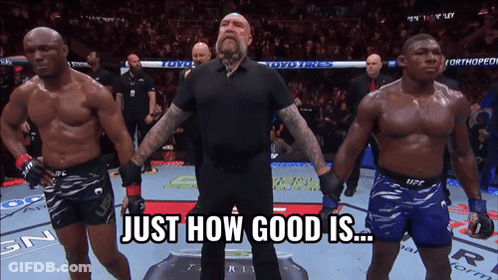 A Referee Stands Between Two Fighters With The Words Just How Good Is Behind Him GIF