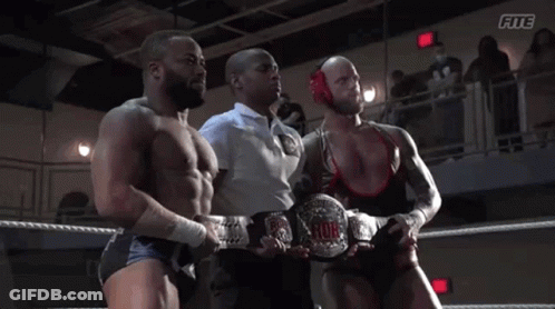 A Referee Stands Between Two Wrestlers In A Wrestling Ring With The Word Fite On The Bottom GIF