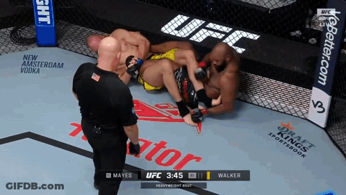 A Referee Watches A Heavyweight Bout Between Mayes And Walker At 3:45 GIF