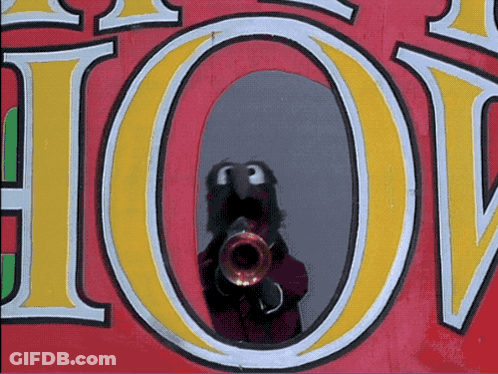 A Reflection Of A Person Playing A Trumpet In A Sign That Says Hot GIF