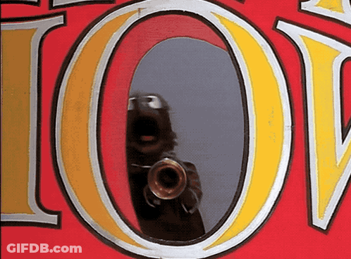 A Reflection Of A Person Taking A Picture With A Camera In The Letter O GIF