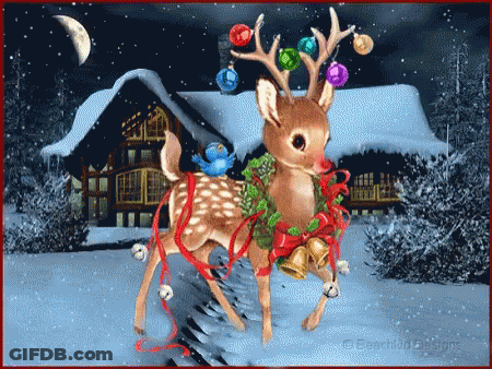 A Reindeer With Christmas Decorations On Its Antlers Stands In Front Of A Snowy House GIF