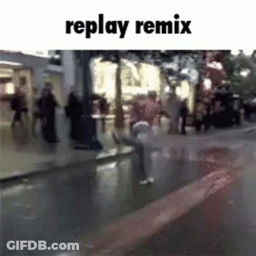 A Replay Remix Video Of A Person Sitting On A Sidewalk In The Rain GIF