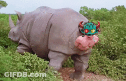 A Rhino Wearing A Costume With Horns And A Pink Nose GIF
