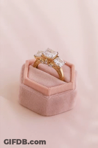 A Ring In A Pink Box With The Words Explore Golden Deals GIF