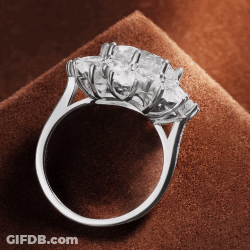 A Ring With A Large Diamond In The Center GIF