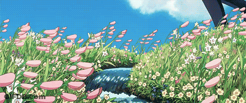 A River Running Through A Field Of Flowers With A Blue Sky In The Background GIF