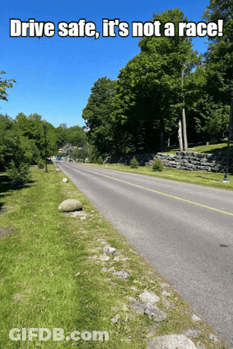 A Road With The Words Drive Safe It 'S Not A Race On It GIF