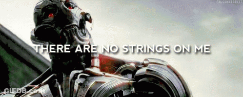 Robot Standing In Front Of Building With No Strings On Me GIF