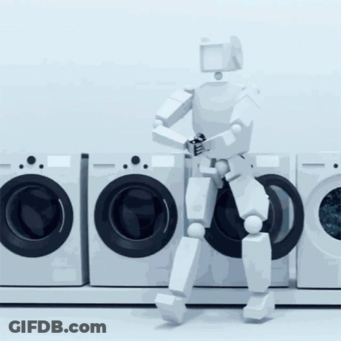 A Robot Is Standing In Front Of A Row Of Washers GIF