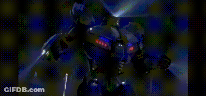 A Robot Is Standing In The Dark And Holding A Gun In Its Hands . GIF