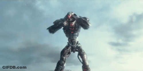 A Robot Is Standing On Its Hind Legs In Front Of A Blue Sky . GIF