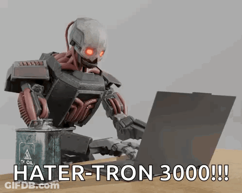 A Robot Is Typing On A Laptop Next To A Can Of Oil GIF