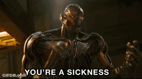 A Robot Says " You 'Re A Sickness " In Front Of A Dark Background GIF
