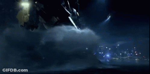 A Robot With A Red Light On Its Head Is Flying Through The Air GIF