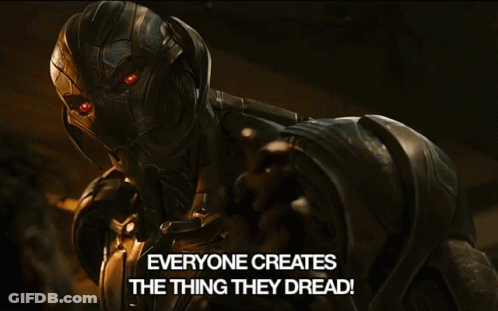 A Robot With Red Eyes And The Words Everyone Creates The Thing They Dread Below It GIF