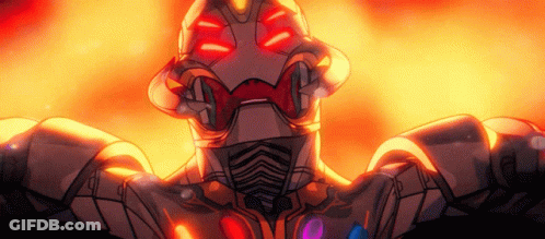 A Robot With Red Eyes Is Standing In Front Of A Fire Background GIF