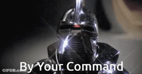 A Robot With The Words By Your Command On The Bottom GIF