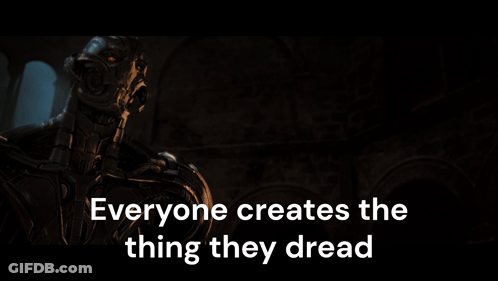 A Robot With The Words Everyone Creates The Thing They Dread On The Bottom GIF