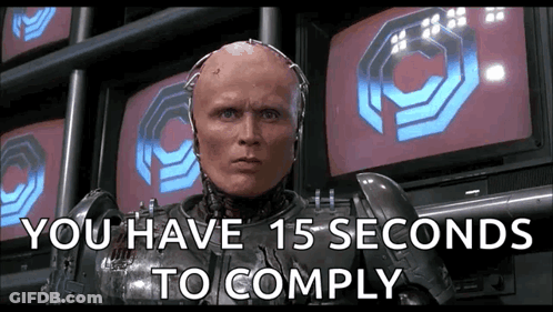 A Robot With The Words " You Have 15 Seconds To Comply " GIF