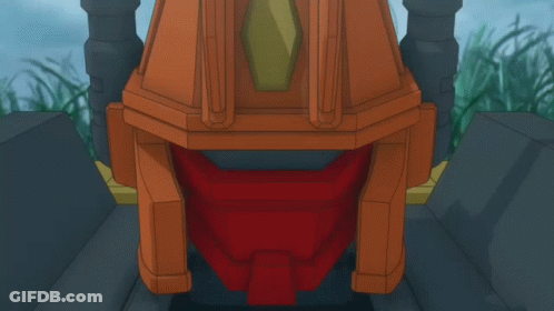 A Robot With Wings Is Standing In A Field Of Tall Grass GIF