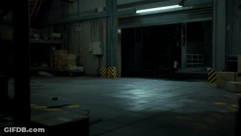 A Robotic Clown With A Red Nose And A Red Circle Around His Neck GIF